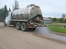 Fergus Power Pump truck applying road stabilization product to road